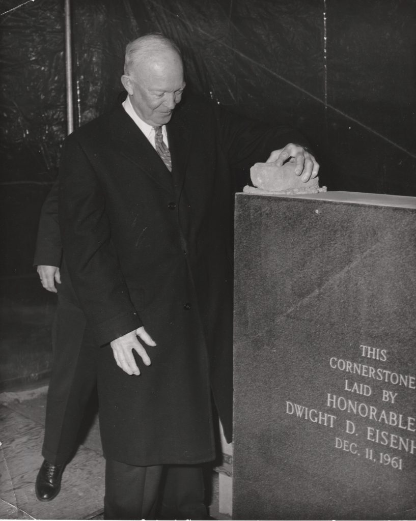Dwight Eisenhower participating in a cornerstone ceremony.
