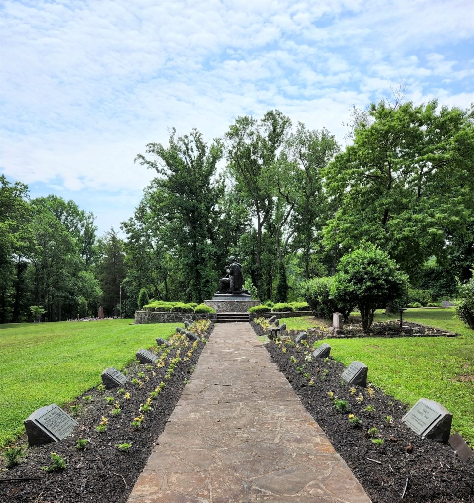 View down a path toward the George Washington in Prayer statue