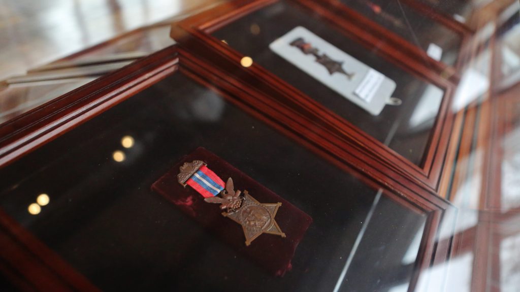 Medals of Honor in wooden and glass cases. 