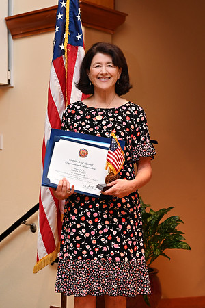 Karen Wilkes, winners of the National Award George Washington Medal of Honor posing with their trophy and certificate