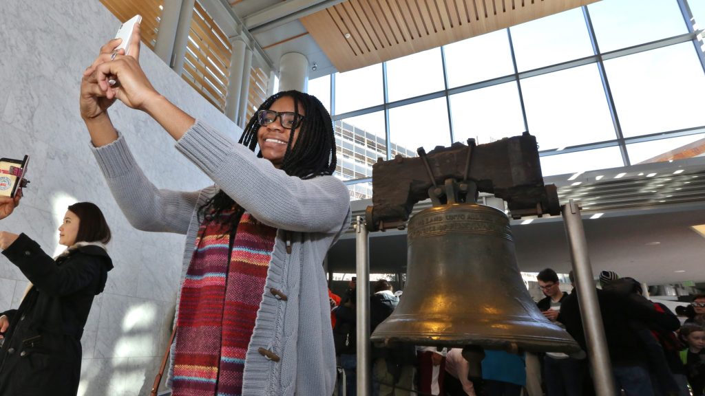 Student taking Picture with Liberty bell picture in Philadelphia